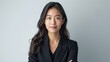 © Антон Сальников - Standing Asian businesswoman with folded arms and looking at camera over white background