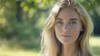 © Marco - portrait of a beautiful blonde woman in a day park with blur background