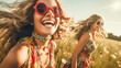 © Kufotos - Two young women with flowing hair, sunglasses and bright clothes with accessories laugh and enjoy in a field of wild flowers in soft sunlight