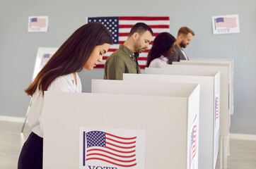 Wall Mural - Serious voters at ballot station with flag of USA. Group of American citizens choosing their future president. Young woman standing in polling booth votes for her candidate. Elections concept