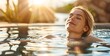 © TigerDude - Beautiful woman relaxing in the spa pool, enjoying her vacation time with closed eyes and blonde hair