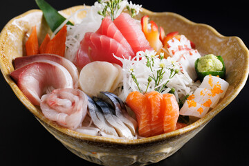 Wall Mural - sashimi set japanese food isolated in black background