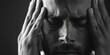 © vefimov - A person is holding their head in their hands, looking concerned or upset