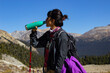 © Hector - Hiker woman drinking water in the Canadian Rockies.