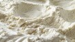 © Justlight - A textured image of flour shows a mixture of large and small grains creating a heterogeneous feel