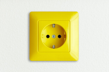 golden socket outlet on white wall