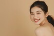 © dreamdes - Smiling young asian woman with perfect skin on beige background. Cosmetology, beauty and cosmetic. Skin care concept. Banner with copy space