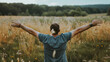© Евгений Архипов - Close-up of a person's arms stretched wide open while standing in a vast field