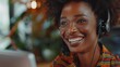 © Emil - Smiling african american customer care representative working with headset in office. Black woman telemarketing agent working in call center. Call center agent with headset makinga video call.