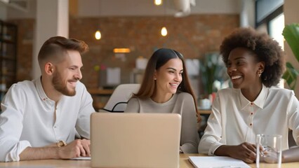 Canvas Print - A group of people, likely entrepreneurs, sitting around a table with a laptop, engaged in a discussion, A team of happy entrepreneurs discussing plans for their next venture