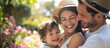 © mittpro - Parents' Day Image. A joyful family portrait with parents and children in a beautiful garden