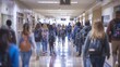 © Ilia Nesolenyi - A wide-angle photo of a high school corridor filled with students walking to and from classes during a class change