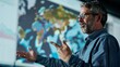 © ELIJA - A professional man with a beard and glasses explains geographic data projected on a large screen in a business meeting