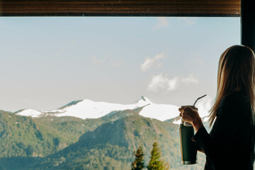 woman looking out of window