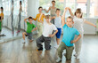 © JackF - Happy preteen children practicing ballroom dances in pairs in training hall during dancing classes
