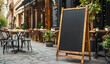 © BOTAHRY DEX - Blank blackboard restaurant shop sign or menu boards near the entrance to restaurant. Cafe menu on the street. Whiteboard sign mockup in front of a restaurant
