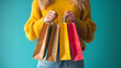 © Jaroon - Woman posing with shopping bag isolated background.