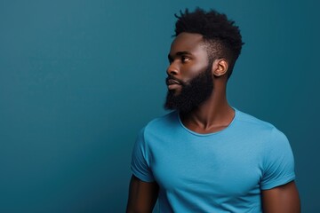 Wall Mural - African American Man in Blue T-shirt: Casual Attire, Confident Smile, Natural Pose