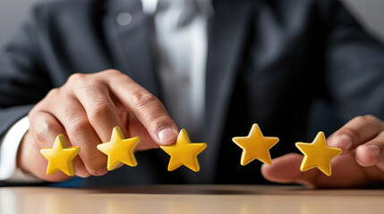 Businessman touching five yellow stars, positive customer review concept for business service quality or good experience