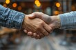 © MMerellinn - Business agreement - deal handshake symbolizing trust and partnership, captured in moment of mutual understanding ,cooperation, highlighting importance of collaboration in professional relationship