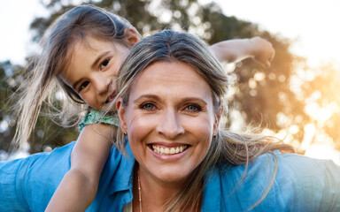 Poster - Happy, portrait or mother and daughter with piggyback, love or hug in park for fun, adventure or journey outdoor at sunset. Family, face and mom carrying girl in a forest with support, trust or games