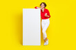© deagreez - Full size portrait of cheerful nice girl hold telephone empty space poster isolated on yellow color background