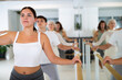 © JackF - Women and men training in ballet class with other dancers