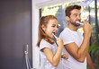 © peopleimages.com - House, brushing teeth and father with girl, cleaning mouth and morning routine with grooming. Family, dad and daughter with fresh breath, dental hygiene and oral care with dental wellness and playful
