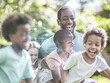 © Ryzhkov - Joyful Father's Day Celebration in the Backyard: Black Father and Mixed-Race Children Playing Soccer on Sunny Afternoon