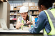 © offsuperphoto - factory workers checking and fixing small machine or mainboard in the factory