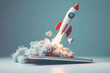 © Emanuel - Startup concept, transparent rocket launching from tablet screen