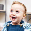 © peopleimages.com - Happy, cute and baby laughing in home for child development, growth and playing for fun. Smile, sweet and adorable boy infant, toddler or kid with joyful positive face in family house in Australia.