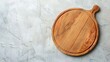 © The Little Hut - Empty wooden round board on white stone kitchen table top view flat lay Wooden pizza platter copy space : Generative AI