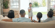 © peopleimages.com - Portrait, performance and child singing with microphone in family home for creativity, talent and show. People, group and young girl in lounge for karaoke, reunion and summer holiday in countryside