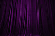 © Ruslan - purple curtain in theatre background