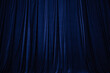 © Ruslan - blue curtain in theatre background