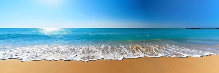 Wall Mural - a serene beach scene with a clear blue sky and gentle waves