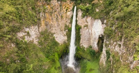 Wall Mural - Waterfall in the tropical mountain jungle. Sipiso Piso falls. Sumatra, Indonesia.
