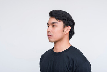 Handsome Asian man in black shirt on white background