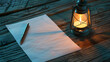 © Dewi - Lantern with blank paper and pen on wood table, mock up note