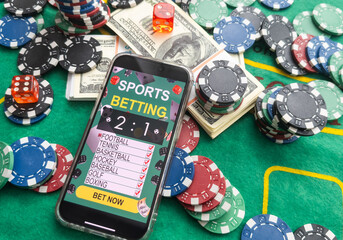 Wall Mural - online casino smartphone with poker chips device over green table