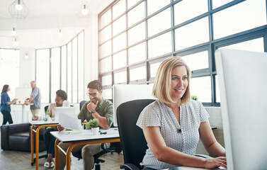 Wall Mural - Business, smile and woman at desk with computer, web design and journalist with research for article. Professional, copywriting agency and employee with pc, connection and online reading with network