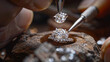 © Mehran - A jeweler uses tools to carefully place a diamond onto a ring. This is a close-up view of the process of making jewelry.