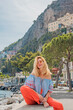 © T.Den_Team - Vacation in Italy. Woman tourist enjoying vacation sun and views. Inspiration Positano, Amalfi coast