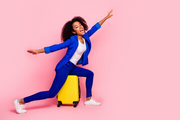 Canvas Print - Photo of cheerful nice charming girl wear trendy blue clothes fly air empty space isolated on pink color background