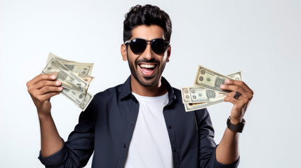 Smiling man in sunglasses holding dollar bills, representing financial success and personal wealth, isolated on a white background.