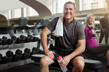 Sports, gym and portrait of senior man with water bottle for training, exercise and workout. Fitness, retirement and person resting with towel, liquid and drink for wellness, health and hydration