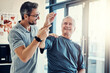 © ReadyAtTheEase/peopleimages.com - Physiotherapy, chiropractor and old man with shoulder pain for rehabilitation, consulting and exercise. Healthcare, physical therapy and person with patient for medical service, wellness and support