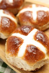 Wall Mural - Tasty hot cross buns on table, closeup