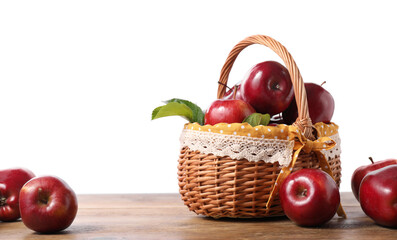 Wall Mural - Fresh ripe red apples and green leaves on wooden table. Space for text